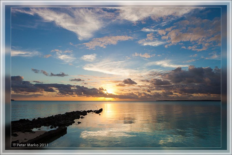 IMG_9269_frame.jpg - Sunset over Aitutaki Lagoon. Old TEAL pier in the foreground. Akaiami, Aitutaki, Cook Islands.